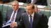 Australia's Prime Minister Tony Abbott speaks about the nation's new anti-extremism strategy during a question time at Parliament House in Canberra, Australia, Feb. 23, 2015. 