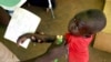 FILE - A Congolese boy has his arm measured for malnutrition in a clinic run by medical charity Medecins Sans Frontieres in the remote town of Dubie in Congo's southeastern Katanga province, March 18, 2006. 