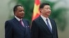 Chinese President Xi Jinping, right, and Congo President Denis Sassou Nguesso listen to their national anthems during a welcoming ceremony inside the Great Hall of the People in Beijing, Sept. 5, 2018.