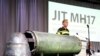На фото: рештки ракети під час доповіді слідчих у справі збиття MH17