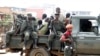 FILE - Congolese soldiers are seen on a pick-up truck after dispersing civilians protesting against what they say is the government's failure to stop killings and inter-ethnic tensions in the town of Butembo, North Kivu province, DRC, Aug. 24, 2016.