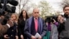 FILE - U.S. President Donald Trump's economic adviser Larry Kudlow is trailed by reporters after speaking at the White House in Washington, April 6, 2018. 