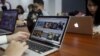 FILE - People work at the office of food-finder app Lozi in Hanoi, Vietnam, April 7, 2016. Vietnam's tech startups are emerging as a force to be reckoned with as foreign private equity funds bet the country's talented young brains will yield more successes. 
