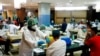 Seorang pedagang menerima dosis vaksin COVID-19 merek Sinovac Biotech China dalam program vaksinasi di Pasar Tanah Abang, pada 17 Februari 2021. (Foto: Reuters/Ajeng Dinar Ulfiana)