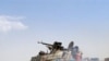 A Yemeni army tank moves to take a position in Saada, north of Sana'a, during clashes with Houthi rebels, 11 Feb 2010