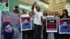 FILE - Pakistani demonstrators take part in a protest over the killing of journalism student Mashal Khan in Karachi, April 22, 2017. Pakistan police arrested 22 people after the lynching of the student accused of blasphemy.