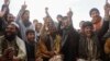 FILE - Afghan fans watch the 2015 Cricket World Cup match between Afghanistan and Bangladesh at a roadside stall in Kabul, Feb. 18, 2015.