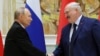 Russian President Vladimir Putin and Belarusian President Alexander Lukashenko shake hands during a ceremony in Minsk, Belarus, on Dec. 6, 2024.