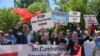 FILE - Supporters of Turkish President Recep Tayyip Erdogan react to anti-Erdogan supporters outside the White House in Washington, D.C., May 16, 2017. Erdogan was meeting with U.S. President Donald Trump.