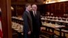 FILE - The Attorneys-General Australia's George Brandis, right, and Britain's Dominic Grieve pose before an evening dinner in the Grand Hall of Gray's Inn in London. 