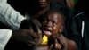 A boy reacts as he receives a yellow fever vaccine injection in the Kisenso district of Kinshasa, Congo, on July 21, 2016.