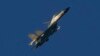 FILE - A Chinese J-11 fighter jet flies above the Taiwan Strait on Aug. 5, 2022. Taiwan reported on Dec. 23, 2023, that Chinese warships and warplanes, including J-11 jets, intruded on its territory.