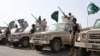 FILE - In this March 30, 2015 photo provided by the Saudi Press Agency (SPA), Royal Saudi Land Forces and units of Special Forces of the Pakistani army take part in a joint military exercise called "Al-Samsam 5" in Shamrakh field, north of Baha region, southwest Saudi Arabia. 