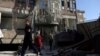 Afghans gather in front of the Shi'ite cultural center after a suicide attack in Kabul, Afghanistan, Dec. 28, 2017.