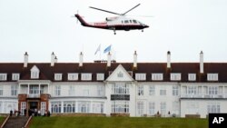 FILE - Then-presidential candidate Donald Trump leaves by his helicopter from the Turnberry golf course in Turnberry, Scotland, Aug. 1, 2015.