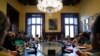 President of the Catalan parliament Carme Forcadell, center, sits with parliament representatives to discuss their next move after Spanish government announced plans to remove members of the region's pro-independence government, at the Catalonia Parliament in Barcelona, Oct. 23, 2017.