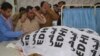 People mourn the death of a police officer and his family members, at a hospital in Quetta, Pakistan, Nov. 15, 2017. 