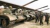 FILE PHOTO - Cambodia's Deputy Prime Minister and Defence Minister Tea Banh (2nd R) inspect tanks inside the Army Institute after a graduation ceremony at Army Institute in Kampong Speu province on March 12, 2015. (REUTERS/Samrang Pring)