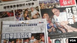 香港媒體報導記者採訪親中團體集會遭遇襲擊（美國之音圖片）