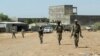 Des membres de la Force spéciale d'Amhara retournent à la base militaire de la 5e division mécanisée de Dansha après avoir combattu le Front de libération du peuple du Tigré, à Danasha, région d'Amhara, près d'une frontière avec le Tigray, en Éthiopie, le 9 novembre 2020.