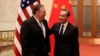 U.S. Secretary of State Mike Pompeo chats with Chinese Foreign Minister Wang Yi before their meeting at the Great Hall of the People in Beijing, China, June 14, 2018. 
