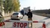 FILE - A policeman stands guard on a road in Mingora, in Swat Valley, Pakistan, Dec. 4, 2016. Saturday, a suicide bombing targeted army officials in a part of the scenic valley where members of the military conduct sports activities.