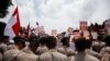 Supporters of national police chief nominee Budi Gunawan rally outside the presidential palace in support of his confirmation, in Jakarta, Indonesia, Feb. 16, 2015.