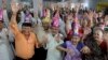 FILE - Elderly Indians participate in celebrations to mark International Day of Older Persons at an old age home in Ahmadabad, India, Oct. 1, 2013.